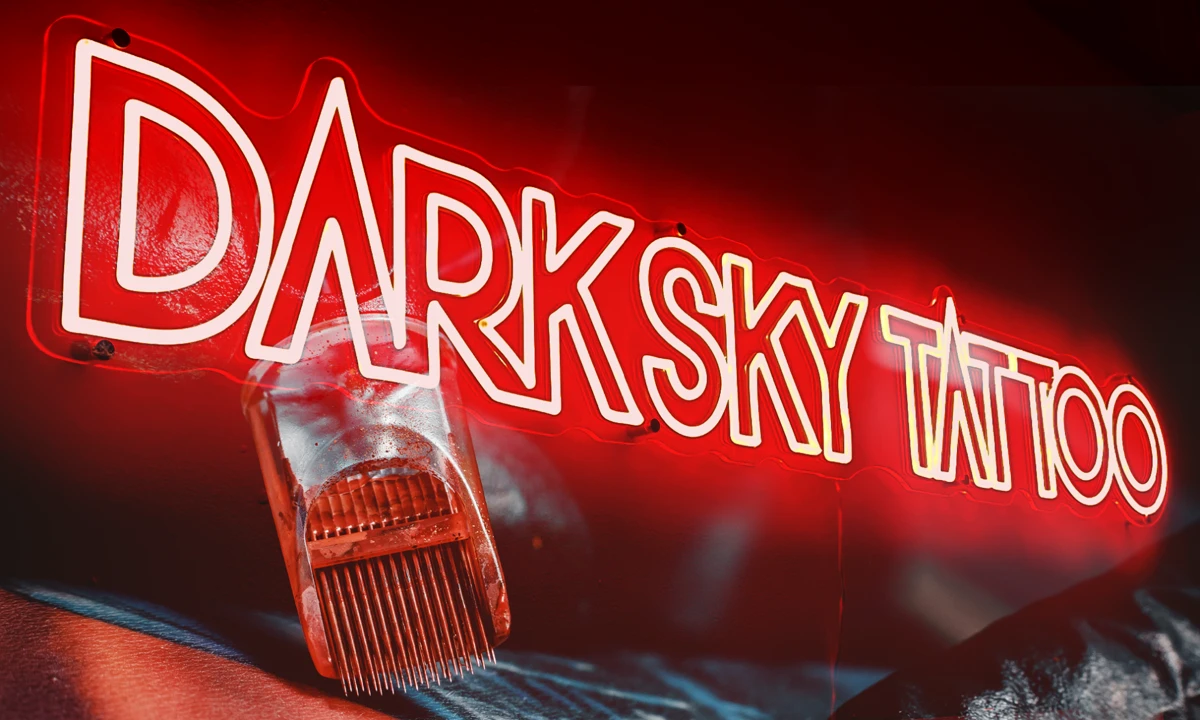 Dark Sky Tattoo red neon sign and tattoo machine